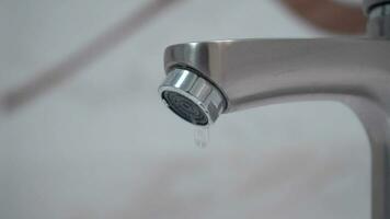 Save energy. People use hand closes water tap. Turn off the water after not use. 4k stock footage. video