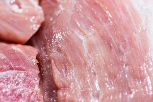 Closeup pieces of raw pork meat photo