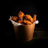 Fried Chicken wings and legs. Bucket full of crispy fried chicken AI generated photo