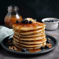 Close-up delicious pancakes, with fresh berries and maple syrup.  Sweet maple syrup flows from a stack of pancake Ai generated photo