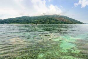 Clear green sea overlook the coral reefs of Koh Lipe island, Thailand photo