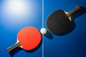 Top view black and red table tennis racket photo