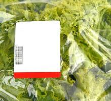 iceberg lettuce in plastic bag package photo