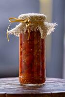 food glass with pickled sliced pepper photo