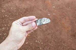 hand holding large piece of diamond photo