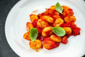 Ñoquis patata plato tomate salsa No carne aperitivo comida comida bocadillo en el mesa Copiar espacio comida antecedentes rústico parte superior ver foto