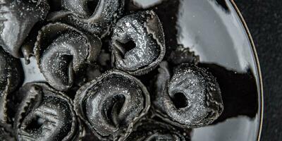 agnolotti black color cuttlefish ink ravioli fresh seafood seafood salmon fish healthy cooking photo