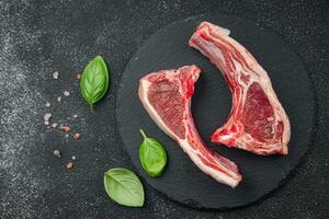 raw lamb meat cutlet on the bone slice food snack on the table copy space food background rustic top view photo