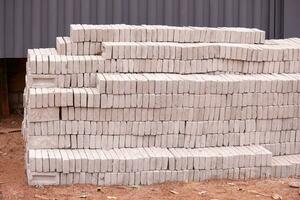 stack of small concrete bricks for building photo