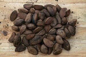 Brazil nuts on a board photo