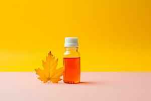 Person taking cough syrup for autumn cold isolated on a gradient background photo