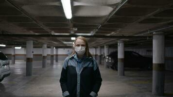 Woman in mask in underground garage video