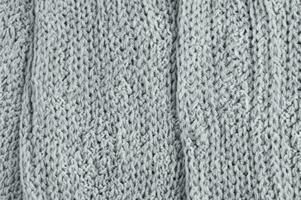 gray knitted fabric background texture, abstract wool texture background. photo