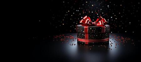 Black Friday background. Gift box with glitter on black background. photo