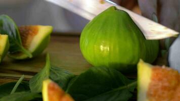 Cutting green fig in half video