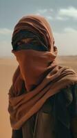 Journey through the Desert A Person Walking with Scarf Protection photo