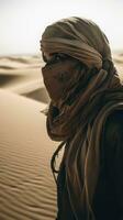 Journey through the Desert A Person Walking with Scarf Protection photo