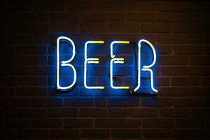 Vintage Beer Neon Sign on Dark Brick Wall with Mug photo