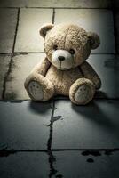 Lonely Teddy Bear on the Floor  Symbol of Solitude and Sadness for Greeting Cards and Posters photo