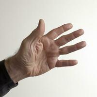 Inviting Gesture A Hand Demonstrating the Come Here Motion on White Background photo