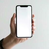 Blank Screen Mobile Phone in Hand on White Background photo