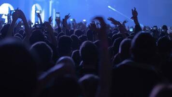 Crowd of dancing music fans at the concert video