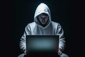 Ethical Hacker in White Hoodie Typing on Laptop for Cybersecurity Concept photo