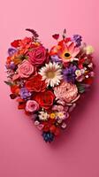 Colorful HeartShaped Flower Bouquet on Pink Background photo