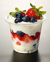 Delicious Yogurt with Fresh Strawberries and Berries in a Plastic Cup AI Generated photo