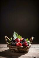 Studio Shot of the basket with berries and fruits on the table photo