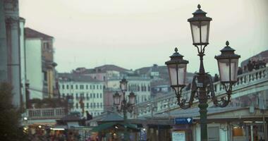 Venice scene with people on the bridge and street lantern video