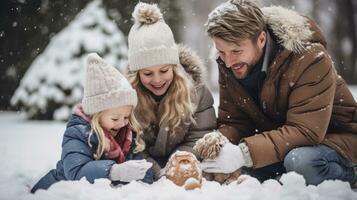 Smiling family playing together in snowy backyard photo