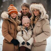 Parents and children sledding down snowy hill together photo