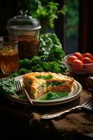 Some salmon and spinach quiche on a plate with a bowl of greens photo