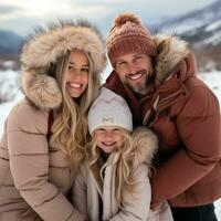 Parents and children sledding down snowy hill together photo