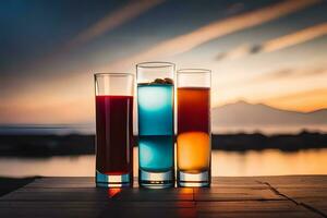 three glasses of colored drinks on a table. AI-Generated photo