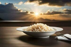 a plate of rice with a fork and knife on a table with a sunset in the background. AI-Generated photo