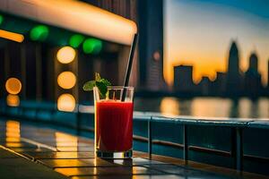 un vaso de rojo jugo sentado en un mesa en frente de un ciudad horizonte. generado por ai foto