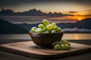 grapes in a bowl on a wooden table with mountains in the background. AI-Generated photo