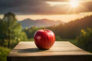 un manzana se sienta en un de madera mesa en frente de un puesta de sol. generado por ai foto