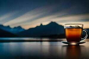 un taza de té se sienta en un mesa en frente de un lago y montañas. generado por ai foto