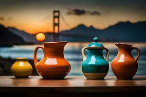 four colorful vases are sitting on a table with a sunset in the background. AI-Generated photo