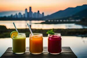 three different juices are sitting on a table with a city in the background. AI-Generated photo