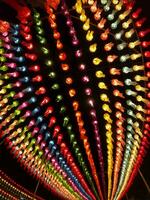 Colorful look up and bottom view of Thai Lanna style lanterns to hang in front of the temple on night time in Loy Kratong Festival. photo