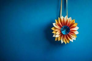 a colorful paper flower hanging from a blue wall. AI-Generated photo