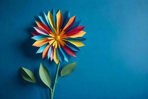 a colorful flower made out of paper on a blue background. AI-Generated photo