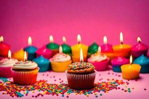 many colorful cupcakes with candles on a pink background. AI-Generated photo