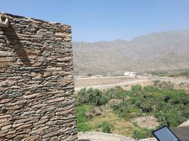 Al Bahah, Saudi Arabia, Sep 2023 - Beautiful daytime view of the historical ruins of Thee Ain Zee Ain or Dhee Ain  Ancient Village in Al Bahah, Saudi Arabia. photo