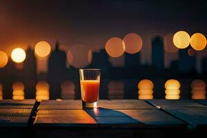 a glass of orange juice on a table in front of a city skyline. AI-Generated photo