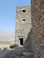 Al Bahah, Saudi Arabia, Sep 2023 - Beautiful daytime view of the historical ruins of Thee Ain Zee Ain or Dhee Ain  Ancient Village in Al Bahah, Saudi Arabia. photo